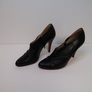 Christian Louboutin Paris black stiletto heeled booties red bottoms in size 37